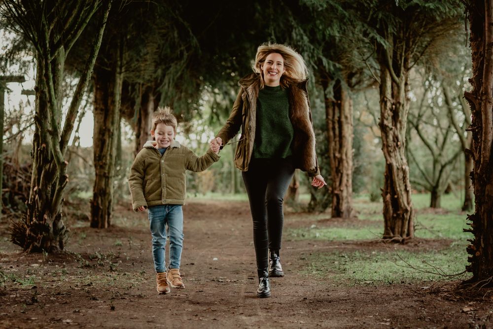Walking together along a scenic forest path during golden hour.