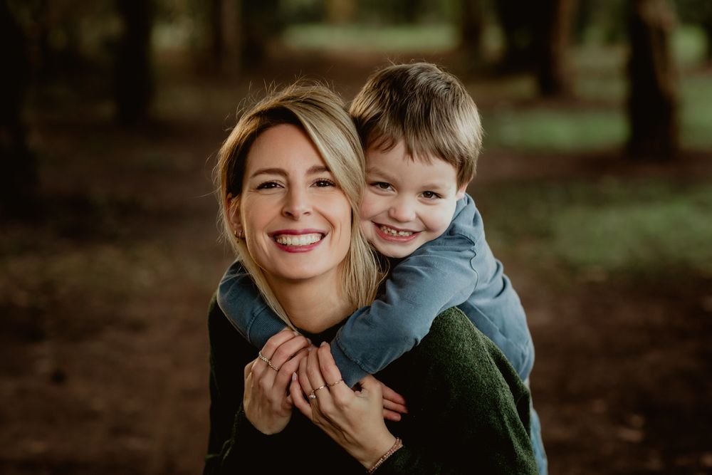 Heartwarming candid moment captured in a natural forest setting.