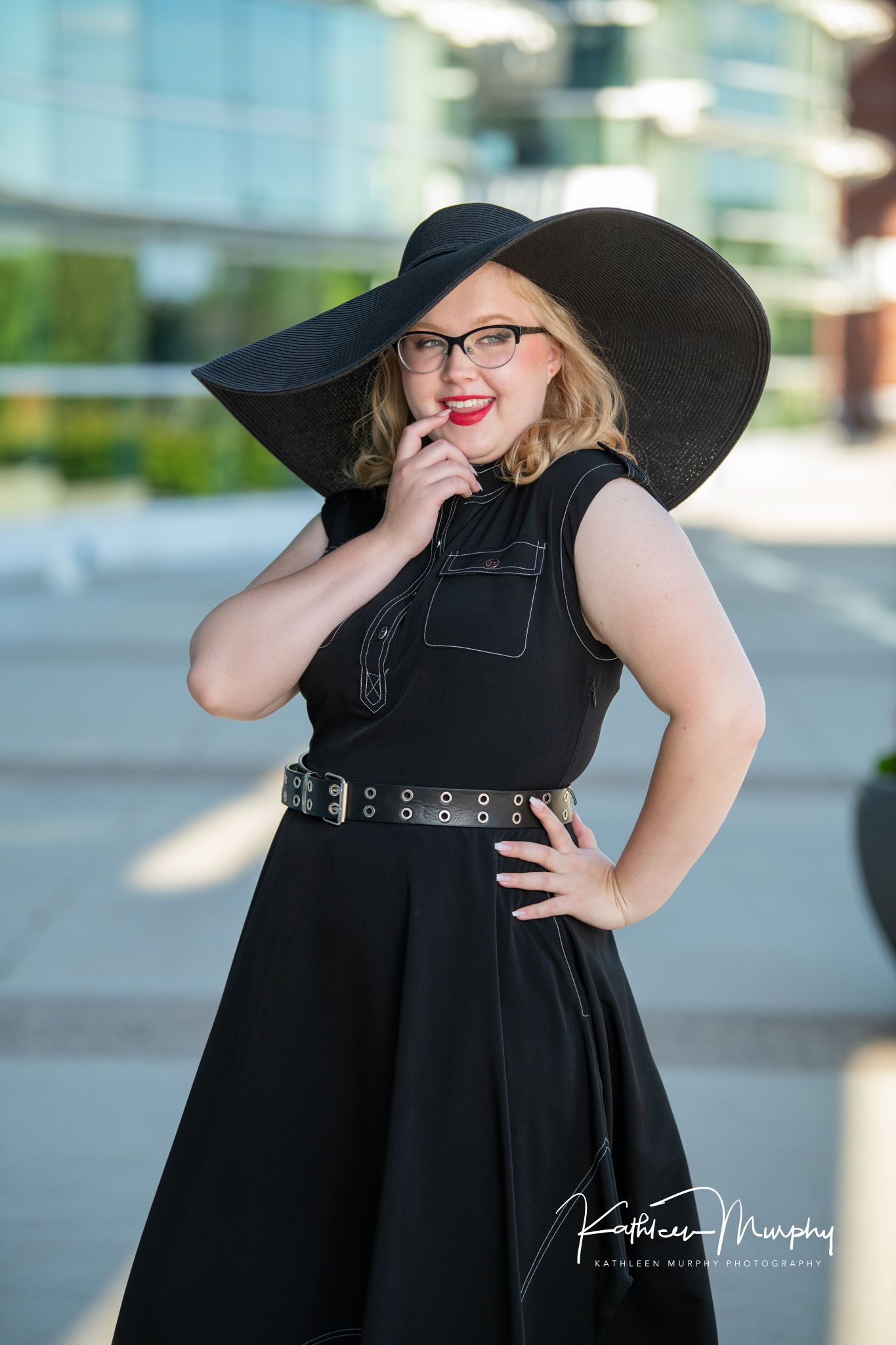 Kathleen Murphy Photography picture of a girl in a black dress with a black floppy hat