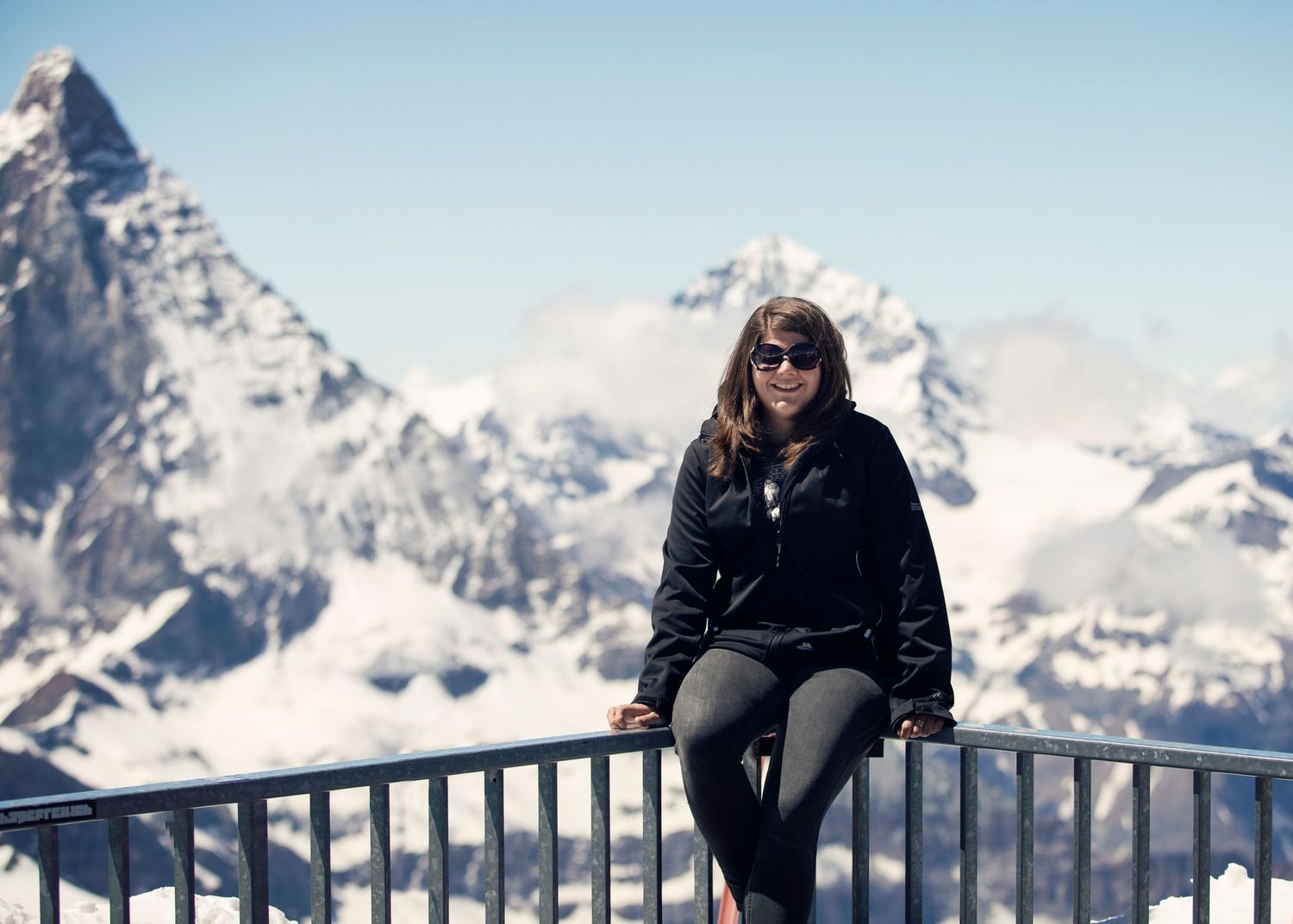 girl sat in front of mountain backdrop