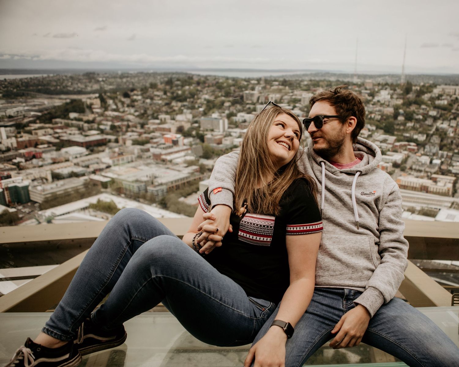 couple in Seattle at top of space needle with a view
