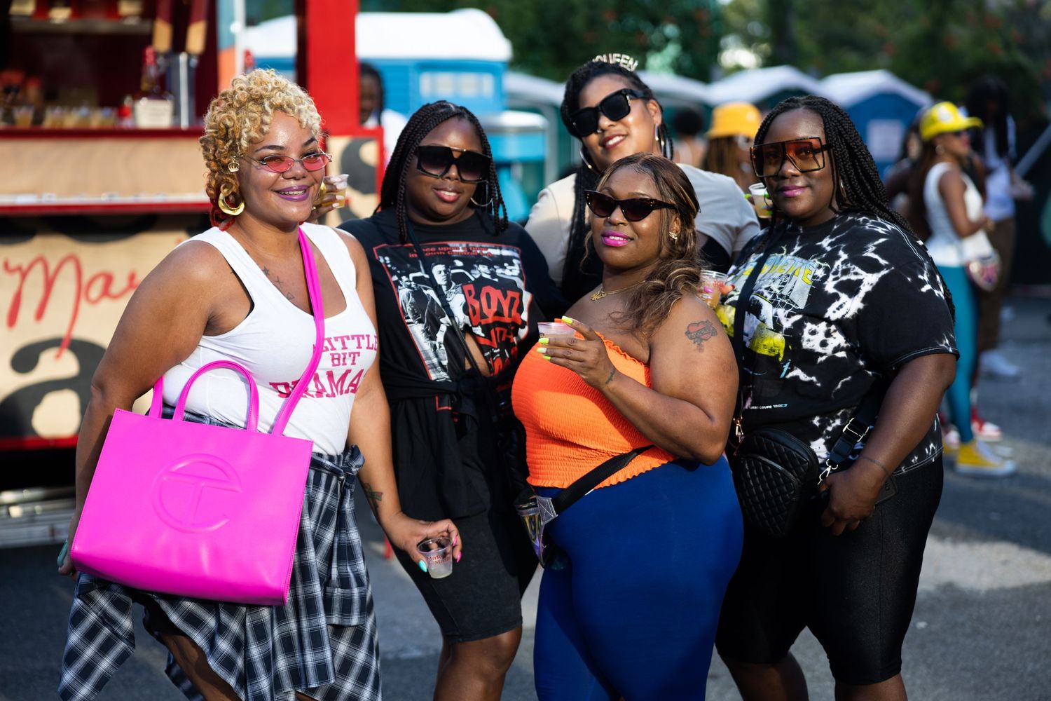 Group of friends gathering at an outdoor summer festival.
