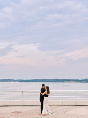 Classic and film-inspired wedding photography in Madison, Wisconsin. Bride and Groom portrait Monona Terrace sunset