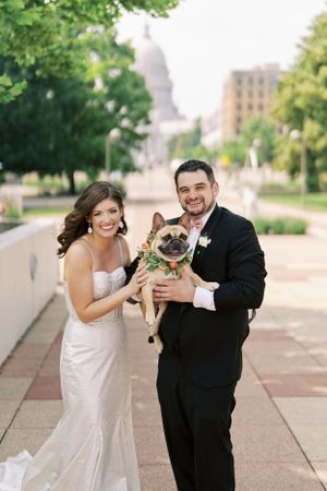 Bride and Groom with a cute dog at Monona Terrace. Classic and film-inspired wedding photography in Madison, Wisconsin.