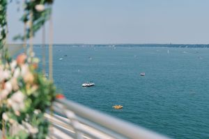 Summer rooftop wedding ceremony backdrop at Monona Terrace. Classic and film-inspired wedding photography in Madison, Wisconsin.