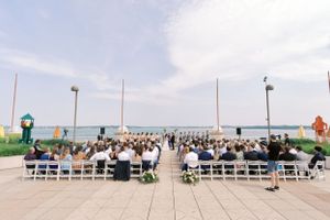 Outdoor wedding ceremony at the Monona Terrace rooftop. Classic and film-inspired wedding photography in Madison, Wisconsin.