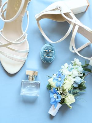 Classic and film-inspired wedding photography in Madison, Wisconsin. Blue wedding details perfume rings shoes bouquet