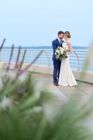 Bride and groom intimate rooftop portrait at The Monona Terrace. Classic and film-inspired wedding photography in Madison, Wisconsin.