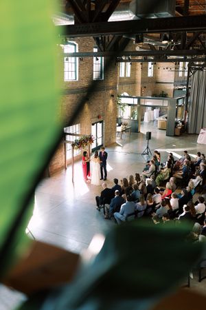 Garver Feed Mill wedding ceremony indoor. Classic and film-inspired wedding photography in Madison, Wisconsin.