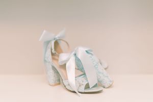 Bride shoes details with blue heels and a bow. Classic and film-inspired wedding photography in Madison, Wisconsin.