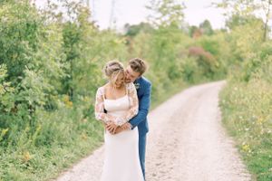 Bride and groom portrait embracing at the Wade House Museum. Classic and film-inspired wedding photography in Madison, Wisconsin.