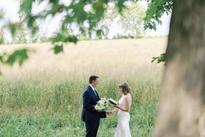 Reading vows in private between bride and groom under a tree. Classic and film-inspired wedding photography in Madison, Wisconsin.