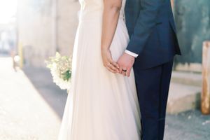 Intimate and candid portrait bride and groom details hands backlit. Classic and film-inspired wedding photography in Madison, Wisconsin.