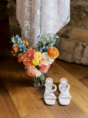Bridal details with shoes, dress and bouquet. Classic and film-inspired wedding photography in Madison, Wisconsin.