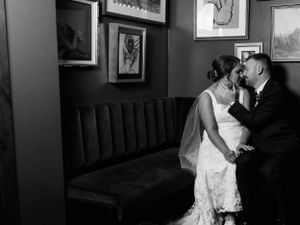 Indoor black and white intimate bride and groom portrait with flash. Classic and film-inspired wedding photography in Madison, Wisconsin.