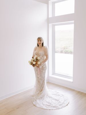 Bride portrait at The Eloise indoors with window backlight. Classic and film-inspired wedding photography in Madison, Wisconsin.