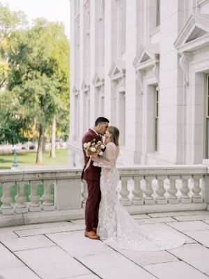 Intimate bride and groom at Capitol building in the summer. Classic and film-inspired wedding photography in Madison, Wisconsin.