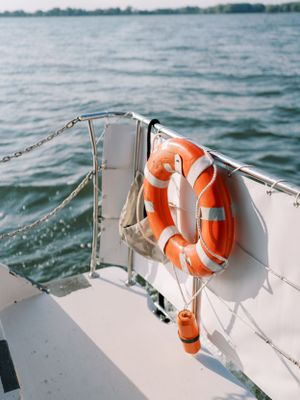 Detail image of a boat life ring on Betty Lou cruises on Lake Mendota. Classic and film-inspired wedding photography in Madison, Wisconsin.
