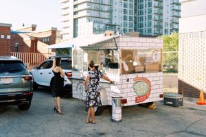 Food carts for dinner at a nontraditional wedding reception. Classic and film-inspired wedding photography in Madison, Wisconsin.