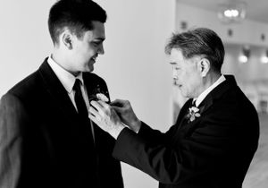 Dad pinning floral on groom at the Eloise indoors. Classic and film-inspired wedding photography in Madison, Wisconsin.