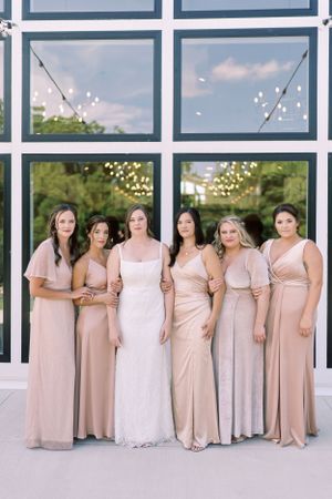 Bride and bridesmaids formal portrait at The Eloise in the summer. Classic and film-inspired wedding photography in Madison, Wisconsin.