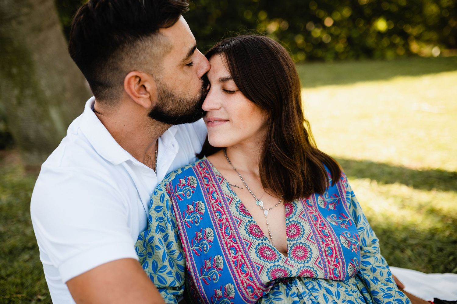 Romantic golden hour photography session in a park with natural lighting.