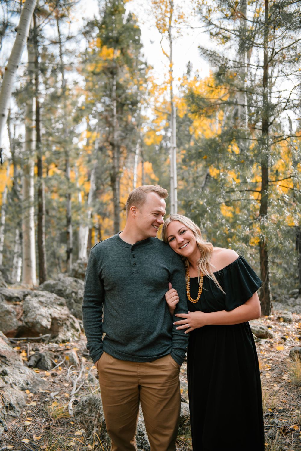Intimate moment shared in an aspen grove with golden fall colors.