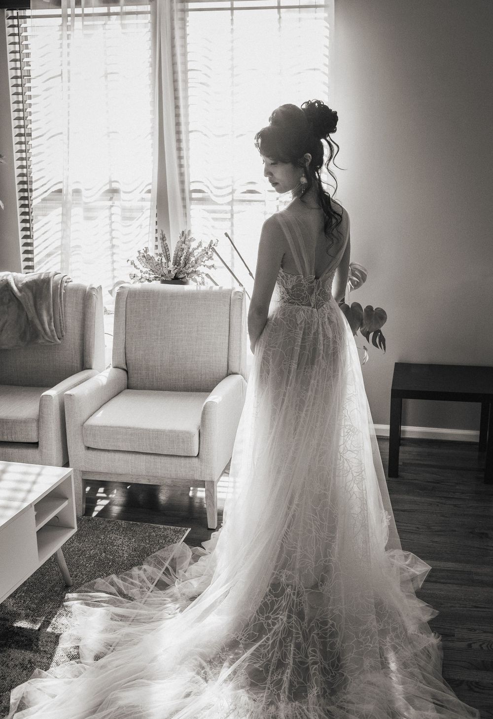 Brookside Gardens wedding. Bride posing in front of window with full dress view