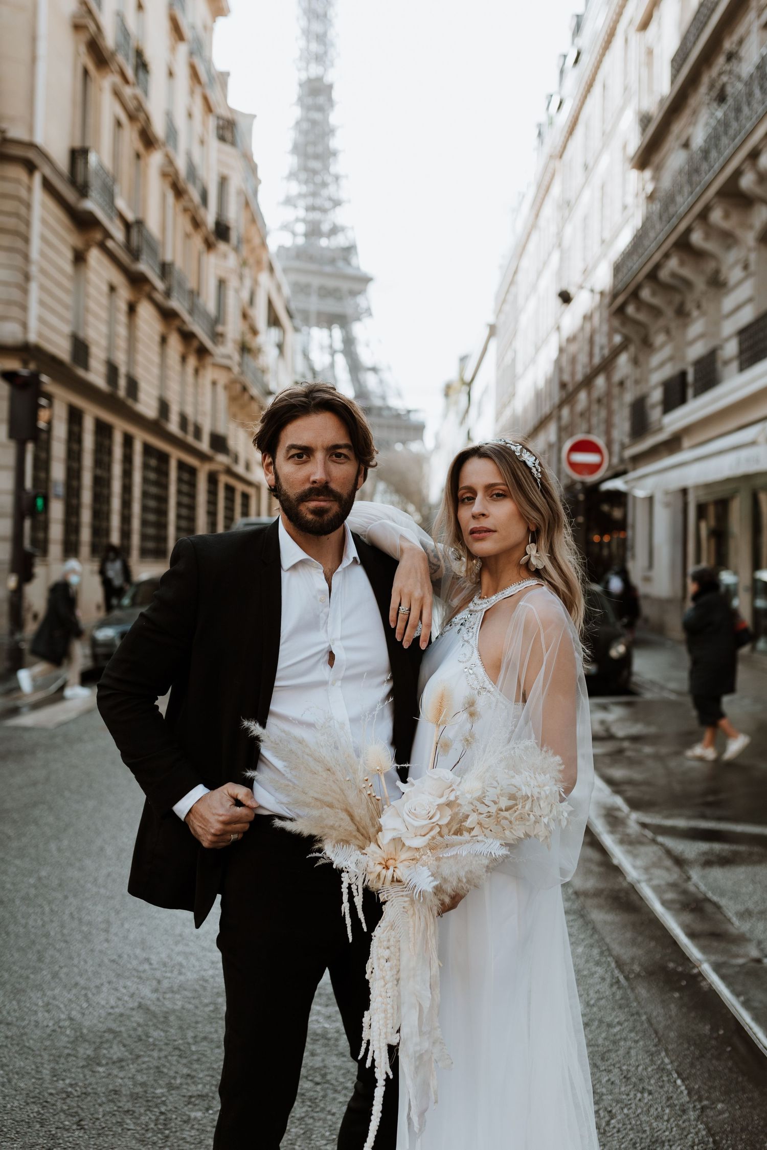 Couples portrait on wedding day on Paris street