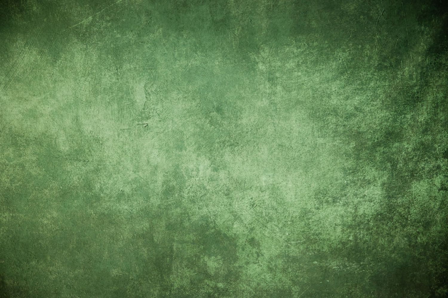 Weathered green textured background with mottled vintage effect.