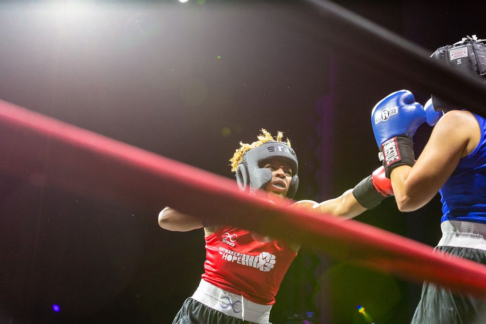 Lash Nolen throws a punch during a charity boxing match