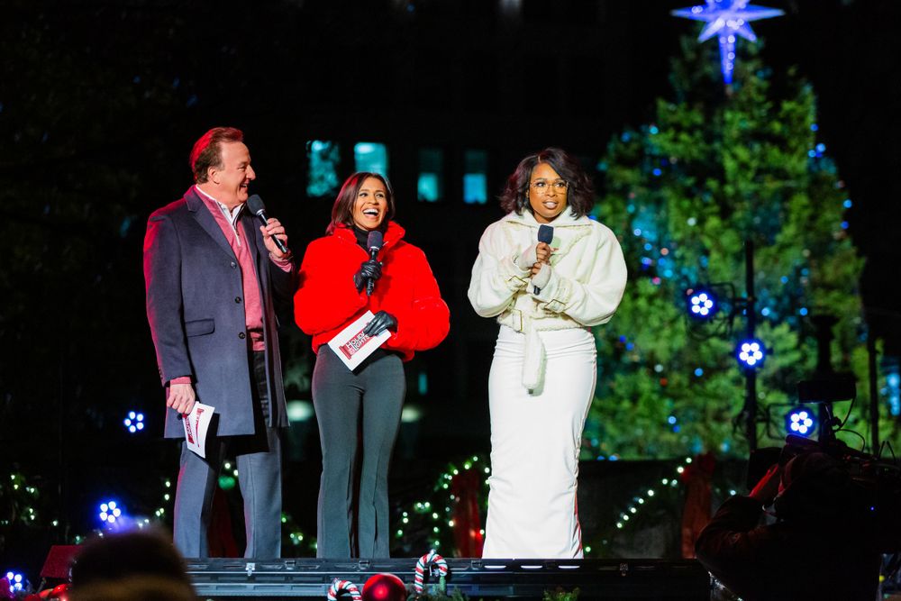 Singer Jennifer Hudson joins WCVB anchors Anthony Everett and Shayna Seymour on stage at a tree lighting event in Boston