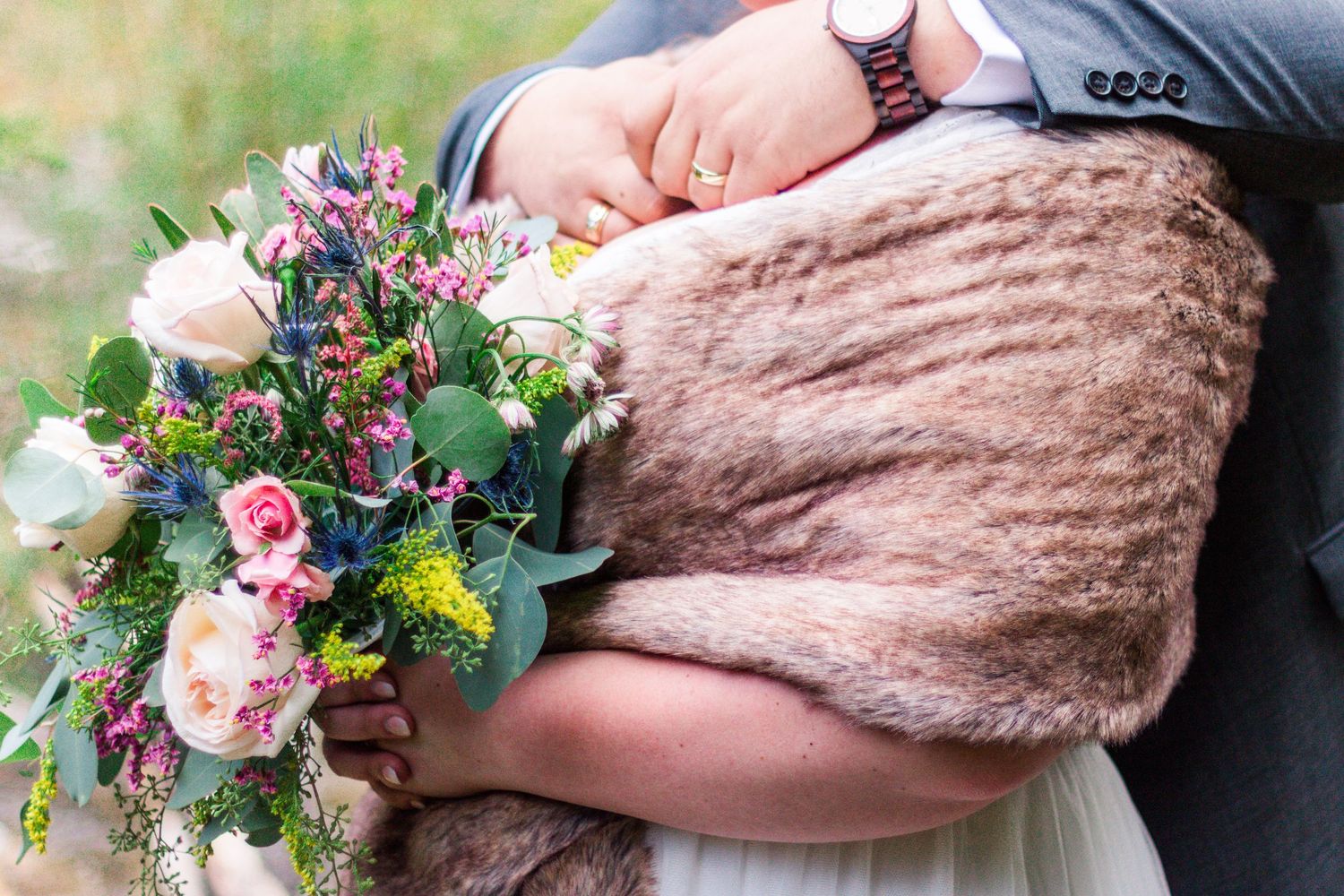 Mountain wedding couple holding each other
