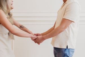 Close up shots of hands holding and connecting in an intimate photo series.