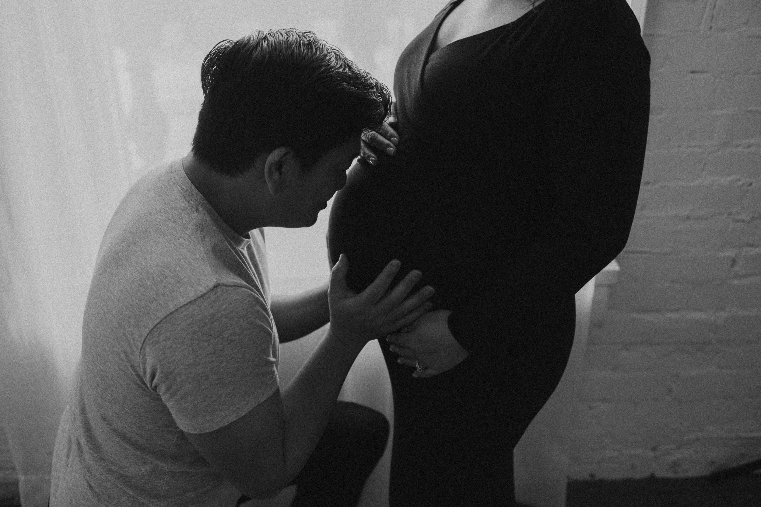 A sequence of intimate black and white portrait shots showing tender moments.