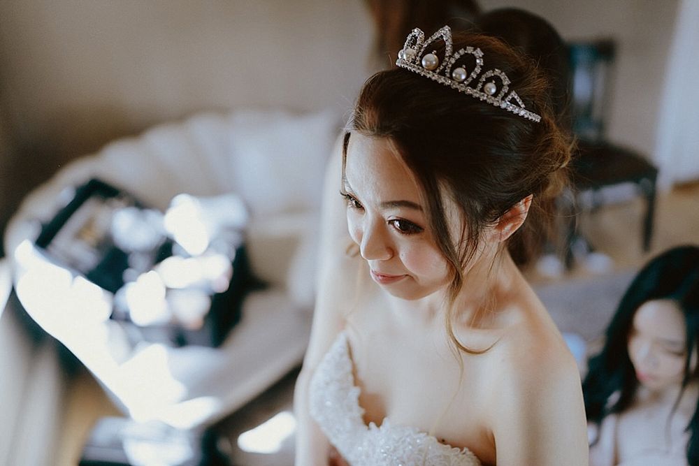 Elegant bridal preparation scene with sparkling tiara and delicate details.