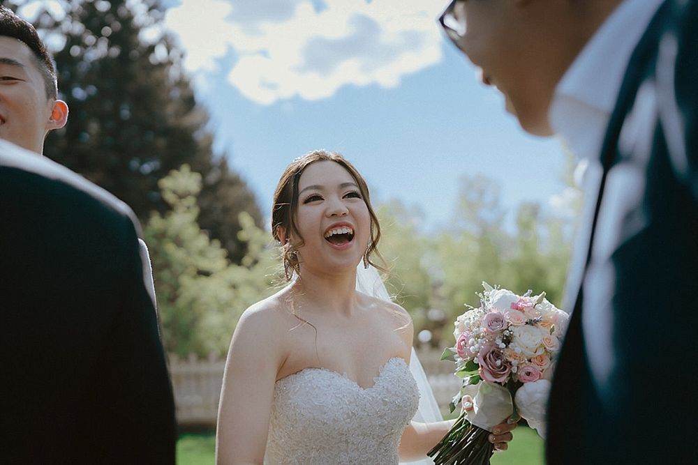 Candid moments of laughter and joy during an outdoor wedding ceremony.
