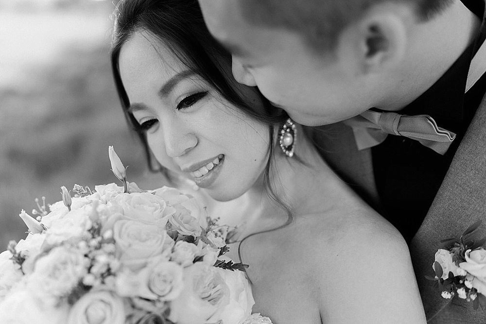 Black and white intimate wedding moments captured during outdoor celebration.