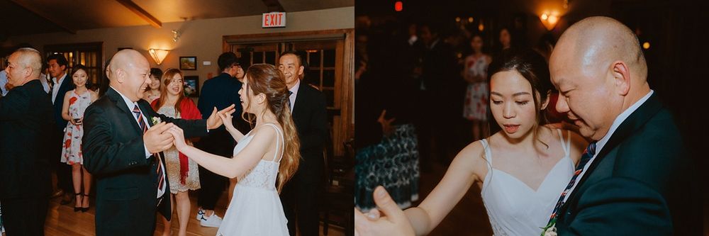 Wedding celebration in full swing with guests dancing under ambient lighting.