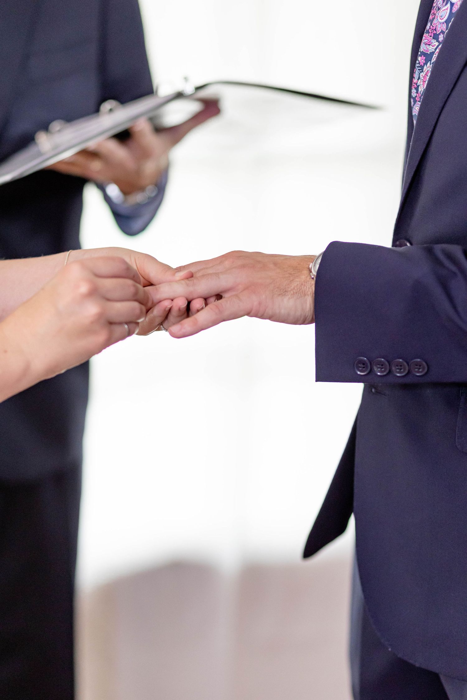 bride and groom exchange rings