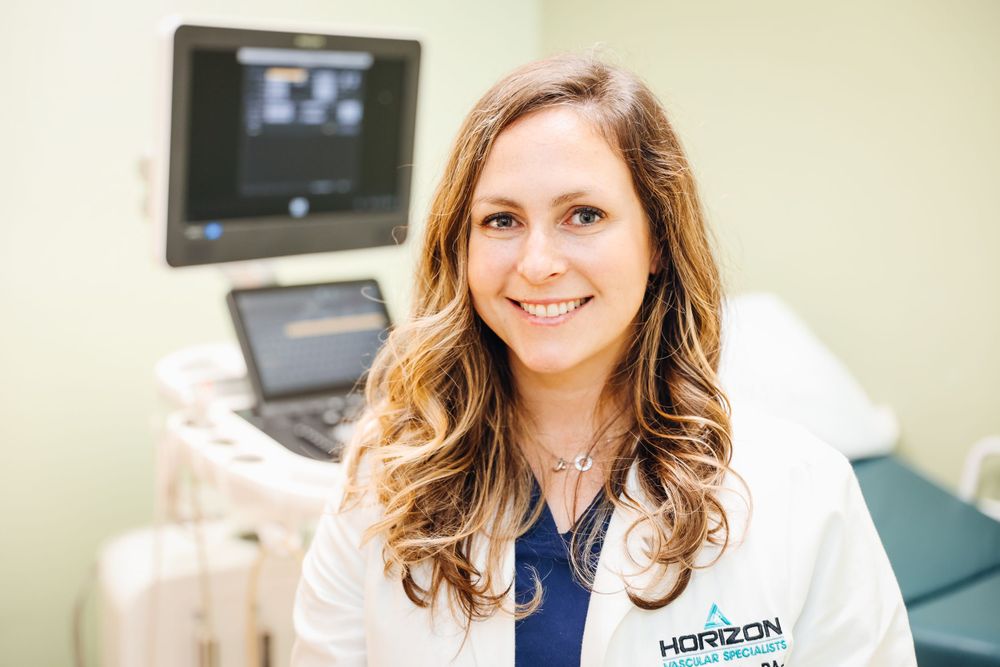 Healthcare professional in medical office with ultrasound equipment.