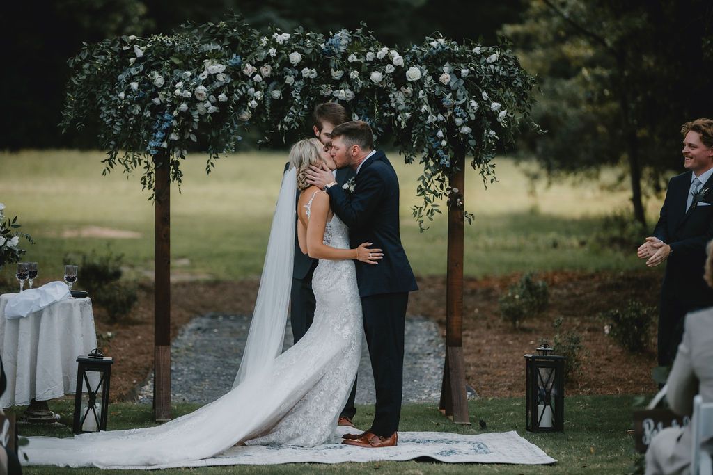 bride and groom kiss