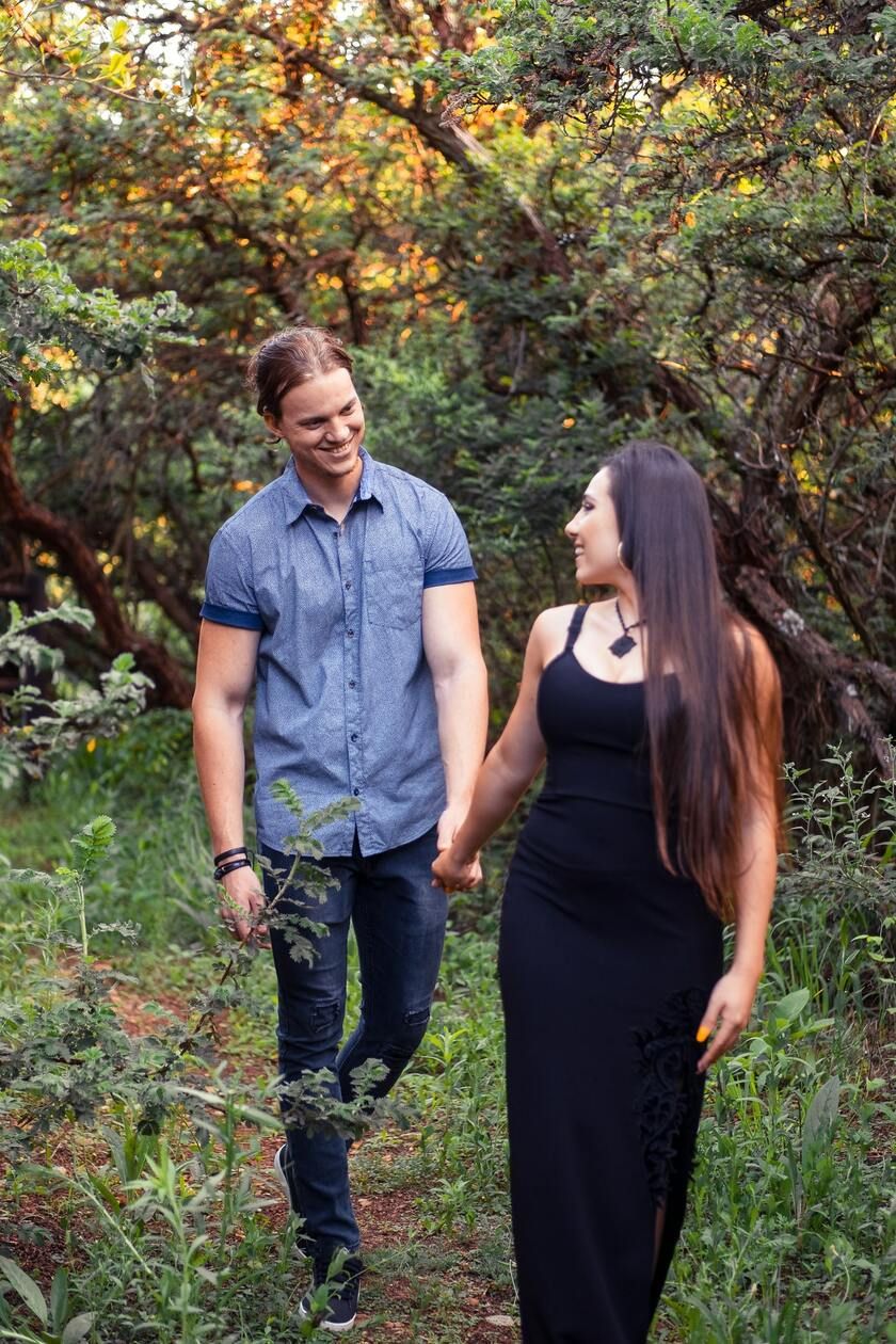 Couple walking in sunset forest