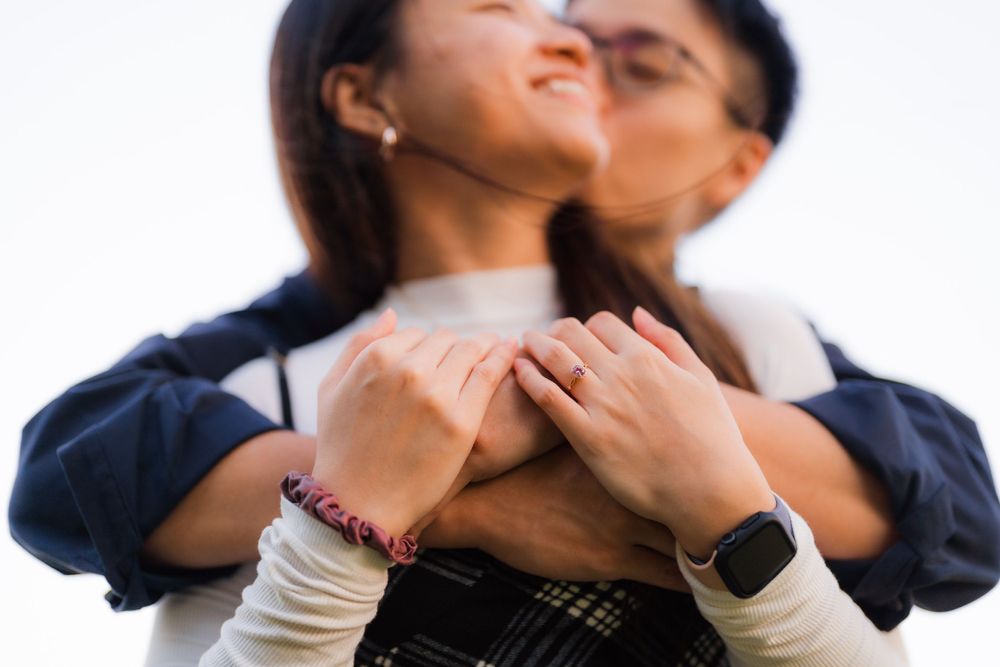 Intimate close-up of romantic couple embracing outdoors.