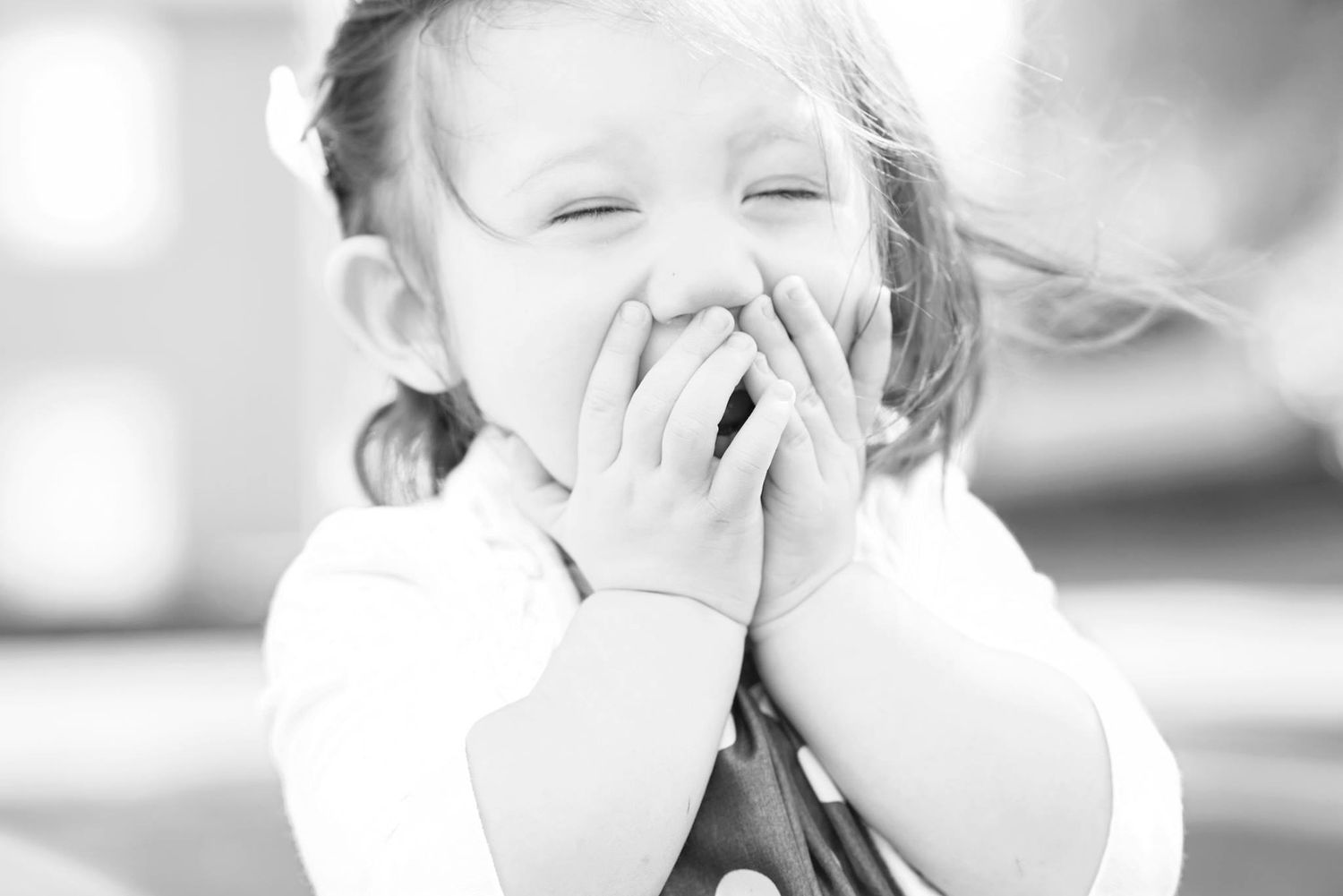 Photo of a baby girl frozen in laughter. Family photography in Victorville Ca. by Ashley Ann Imagery