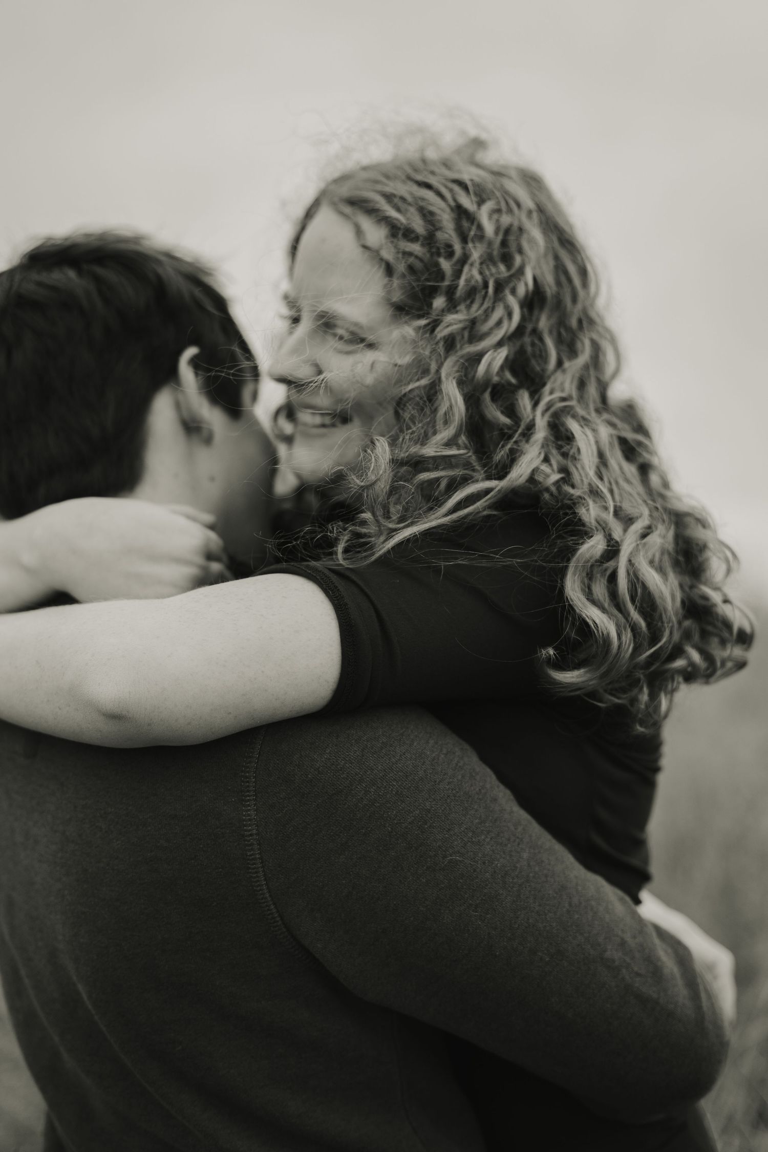 Couple Shoot - Jake and Emily spinning at Picnic Point in Madison, Wisconsin