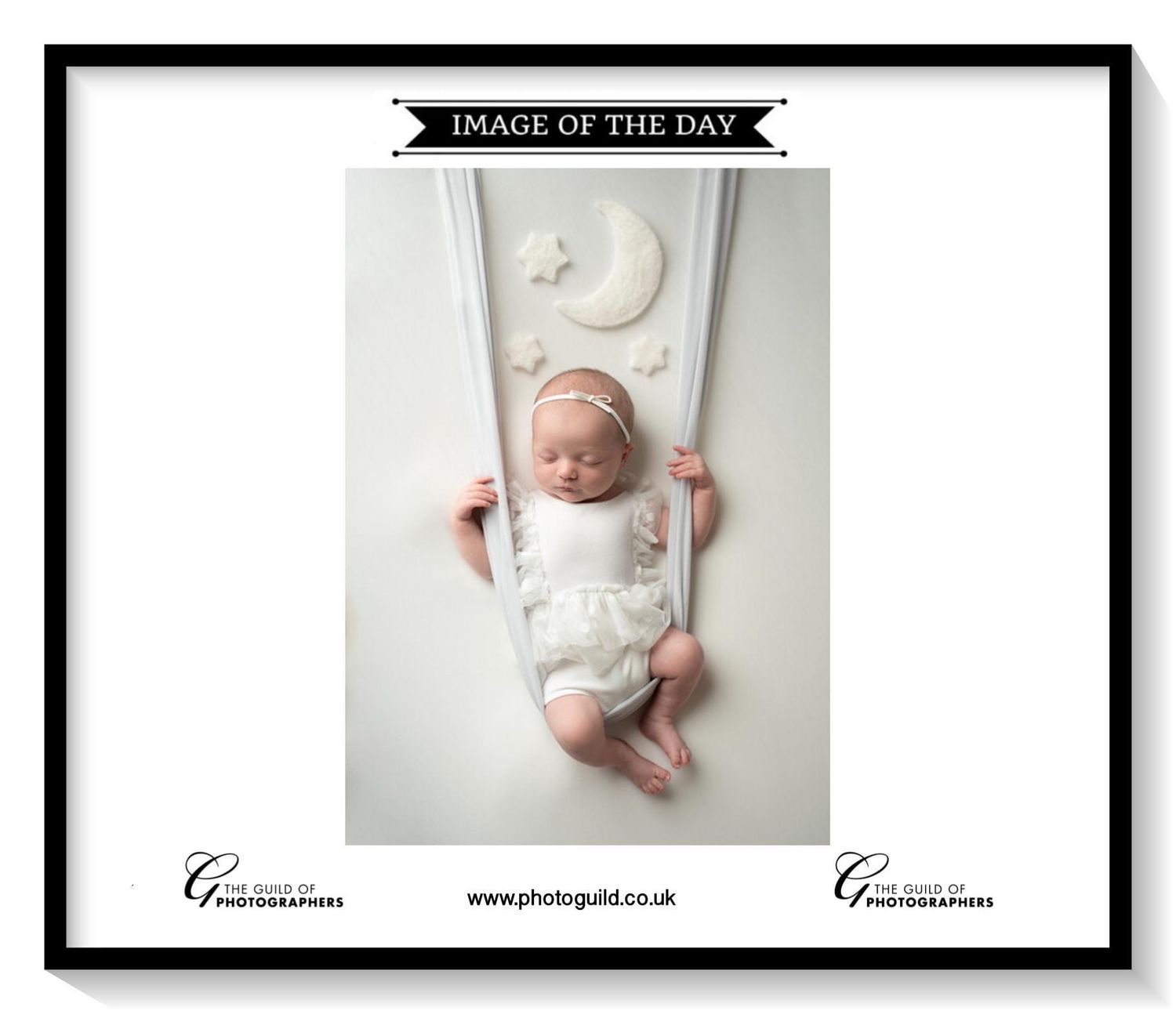 baby in a swing image of the day