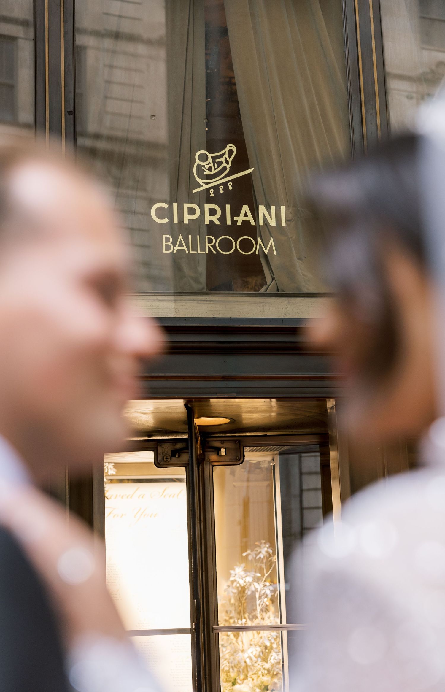 Entrance to the Cipriani Ballroom with gold lettering on glass door.