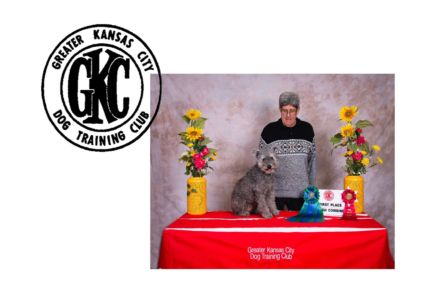 Pet training company logo with a formal portrait of a gray dog against floral backdrop.