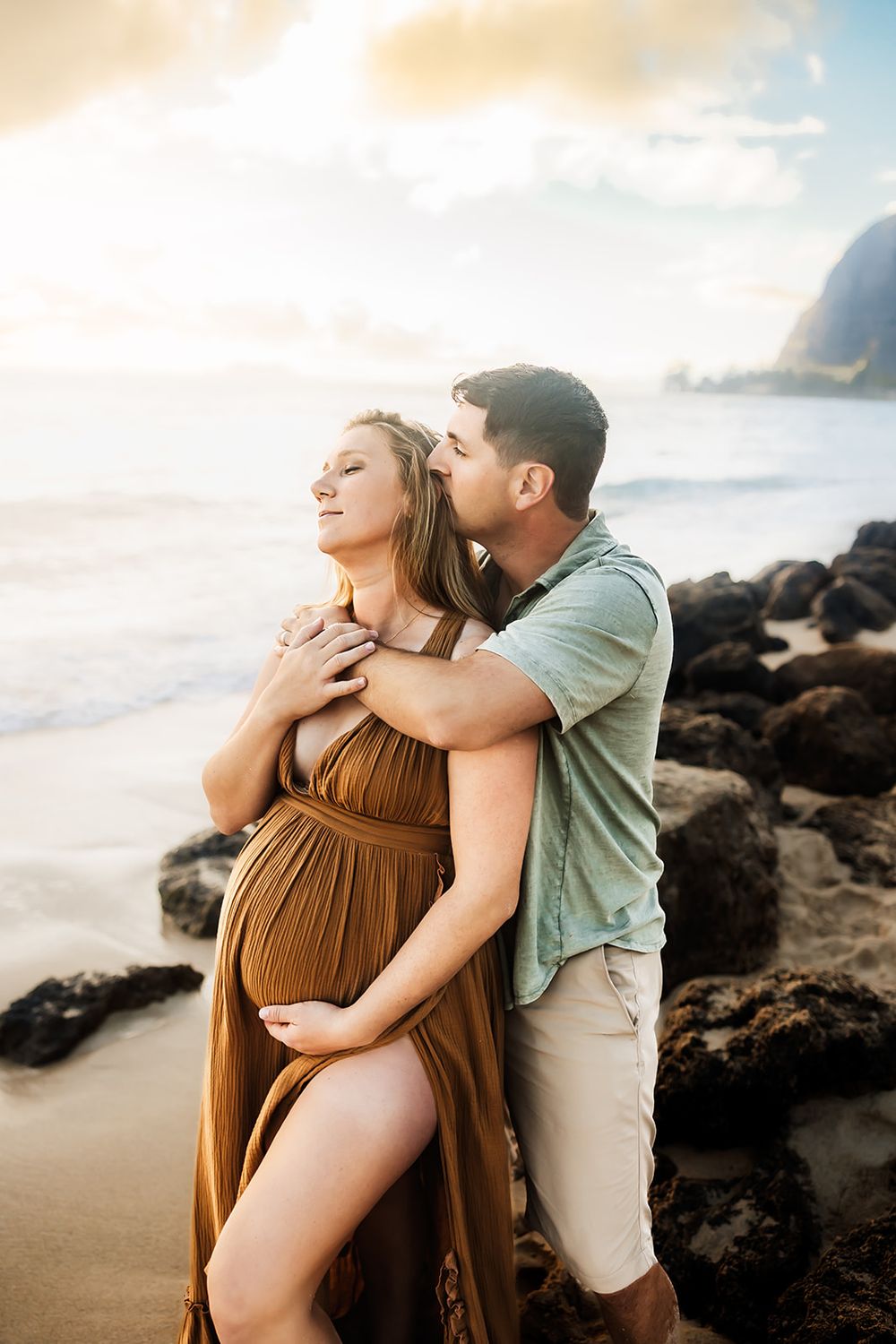 Oahu Maternity Photographer captures an expectant mother at Ka'a'wa beach on Oahu.
